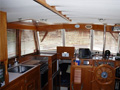 Wood windshield blinds enrich the yacht interior with classic style. The slats can be tilted to control direct sunlight and allow for a view. 80% heat rejection.